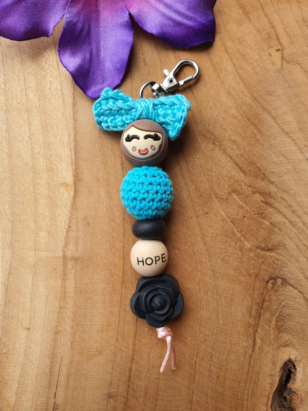 Sleutelhanger / Tassenhanger Gelukspoppetje vrouw met strik &